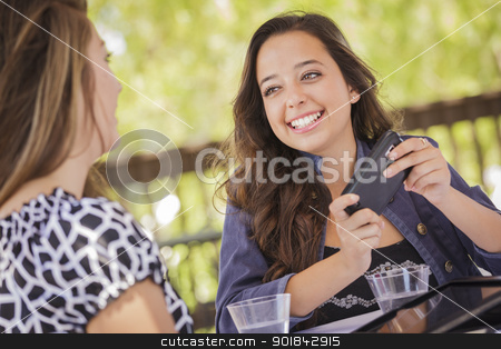 To use this stock image in your creative project, please select the size you need over to the right and click the "Add to Cart" button.
Your downloaded image will come with the Cutcaster watermark removed so don’t worry about the watermark you see on this page. Mixed Race Girls Working on Electronic Devices stock photo, Attractive Mixed Race Girls Smiling and Talking While Working on Smart Mobile Phone and Tablet Computer. by Andy Dean