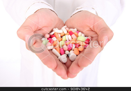 To use this stock image in your creative project, please select the size you need over to the right and click the "Add to Cart" button.
Your downloaded image will come with the Cutcaster watermark removed so don’t worry about the watermark you see on this page. Bunch of meds stock photo, Young doctor is offering to you bunch of different pills as medication for your good health isolated on the white background (shalow dept) by vaximilian