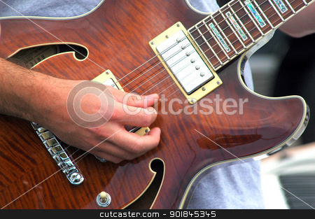To use this stock image in your creative project, please select the size you need over to the right and click the "Add to Cart" button.
Your downloaded image will come with the Cutcaster watermark removed so don’t worry about the watermark you see on this page. Guitarist. stock photo, Guitarist performing on stage in concert. by OSCAR Williams