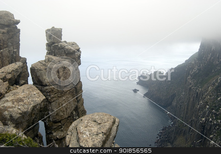 To use this stock image in your creative project, please select the size you need over to the right and click the "Add to Cart" button.
Your downloaded image will come with the Cutcaster watermark removed so don’t worry about the watermark you see on this page. Dolerite Cliffs Cape Pillar stock photo, Precarious stacks of dolerite form the rugged cliffs of Cape Pillar, Tasmania by Stephen Gibson