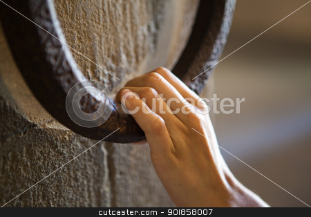 To use this stock image in your creative project, please select the size you need over to the right and click the "Add to Cart" button.
Your downloaded image will come with the Cutcaster watermark removed so don’t worry about the watermark you see on this page. Woman knocking on a clapper stock photo, A woman is knocking on an old metal clapper by Dario Rota