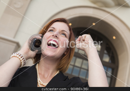To use this stock image in your creative project, please select the size you need over to the right and click the "Add to Cart" button.
Your downloaded image will come with the Cutcaster watermark removed so don’t worry about the watermark you see on this page. Young Businesswoman with Fist in Air On Cell Phone stock photo, Young Businesswoman with Fist in the Air On Cell Phone in Front of Building. by Andy Dean
