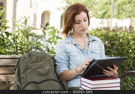 To use this stock image in your creative project, please select the size you need over to the right and click the "Add to Cart" button.
Your downloaded image will come with the Cutcaster watermark removed so don’t worry about the watermark you see on this page. Young Female Student Outside on Bench Using Touch Tablet stock photo, Young Pretty Female Student Outside with Backpack and Books Sitting on Bench Using Touch Tablet. by Andy Dean