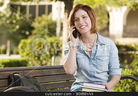 To use this stock image in your creative project, please select the size you need over to the right and click the "Add to Cart" button.
Your downloaded image will come with the Cutcaster watermark removed so don’t worry about the watermark you see on this page. Young Female Student Outside Using Cell Phone Sitting on Bench stock photo, Smiling Young Pretty Female Student Outside on Cell Phone with Backpack and Books Sitting on Bench. by Andy Dean