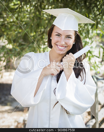 To use this stock image in your creative project, please select the size you need over to the right and click the "Add to Cart" button.
Your downloaded image will come with the Cutcaster watermark removed so don’t worry about the watermark you see on this page. Graduating Mixed Race Girl In Cap and Gown with Diploma stock photo, Attractive Mixed Race Girl Celebrating Graduation Outside In Cap and Gown with Diploma in Hand. by Andy Dean