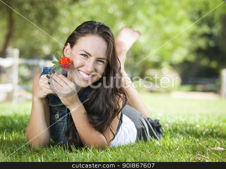 To use this stock image in your creative project, please select the size you need over to the right and click the "Add to Cart" button.
Your downloaded image will come with the Cutcaster watermark removed so don’t worry about the watermark you see on this page. Attractive Mixed Race Girl Portrait Laying in Grass stock photo, Attractive Mixed Race Girl Portrait Laying in Grass Outdoors with Flower. by Andy Dean