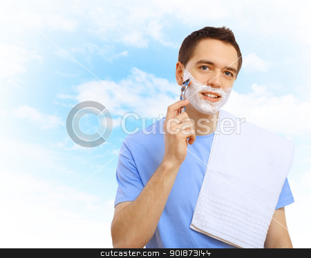 To use this stock image in your creative project, please select the size you need over to the right and click the "Add to Cart" button.
Your downloaded image will come with the Cutcaster watermark removed so don’t worry about the watermark you see on this page. Young man shaving stock photo, Young man in blue T-shirt shaving himself by Sergey Nivens