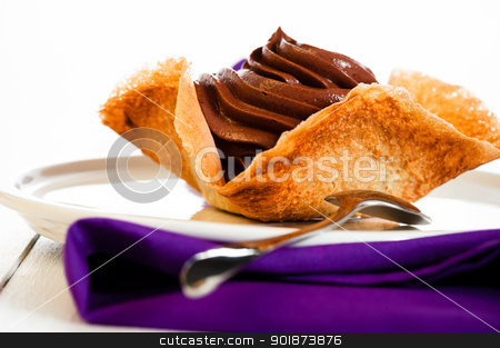 To use this stock image in your creative project, please select the size you need over to the right and click the "Add to Cart" button.
Your downloaded image will come with the Cutcaster watermark removed so don’t worry about the watermark you see on this page. Mousse au chocolat stock photo, Mousse au chocolat in a tuile basket on white wooden table by p.studio66