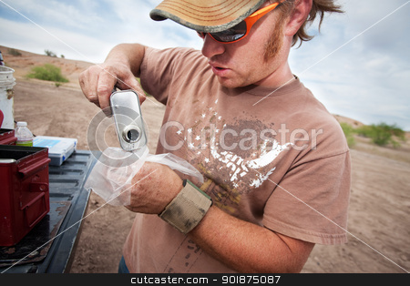 To use this stock image in your creative project, please select the size you need over to the right and click the "Add to Cart" button.
Your downloaded image will come with the Cutcaster watermark removed so don’t worry about the watermark you see on this page. Movie Crew Member Pouring Explosive Powder stock photo, Movie crew member pouring explosive powder into a plastic bag by Scott Griessel