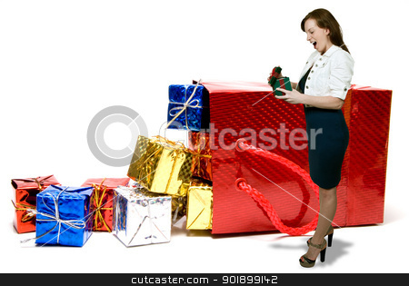 To use this stock image in your creative project, please select the size you need over to the right and click the "Add to Cart" button.
Your downloaded image will come with the Cutcaster watermark removed so don’t worry about the watermark you see on this page. Woman Christmas Presents stock photo, Woman with a pile of seasonal presents given during the Christmas season by Robert Byron