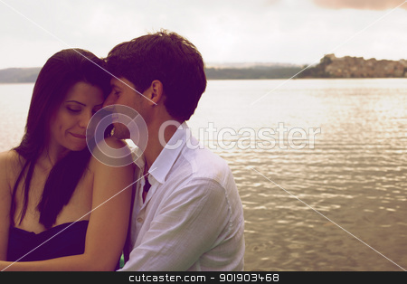 To use this stock image in your creative project, please select the size you need over to the right and click the "Add to Cart" button.
Your downloaded image will come with the Cutcaster watermark removed so don’t worry about the watermark you see on this page. Magic romantic moment during sunset on italian lake stock photo, Couple in love on a lake during sunset by federico marsicano