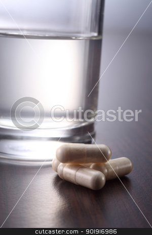 To use this stock image in your creative project, please select the size you need over to the right and click the "Add to Cart" button.
Your downloaded image will come with the Cutcaster watermark removed so don’t worry about the watermark you see on this page. medicine and water stock photo, medicine and a glass of water by eskaylim