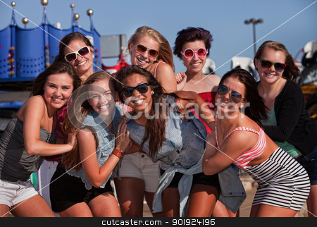 To use this stock image in your creative project, please select the size you need over to the right and click the "Add to Cart" button.
Your downloaded image will come with the Cutcaster watermark removed so don’t worry about the watermark you see on this page. Happy Best Friends Outside stock photo, Happy group of eight teenage girls together at a theme park by Scott Griessel
