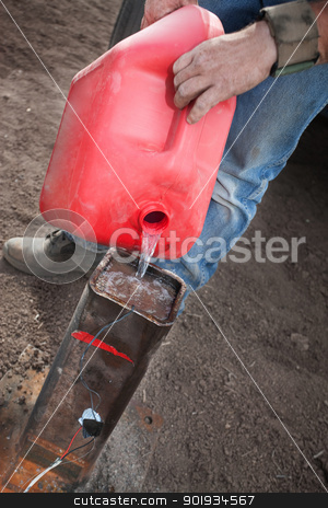 To use this stock image in your creative project, please select the size you need over to the right and click the "Add to Cart" button.
Your downloaded image will come with the Cutcaster watermark removed so don’t worry about the watermark you see on this page. Special Effects Worker Pouring Gasoline stock photo, Special effects worker pours gasoline into canister for detonation device by Scott Griessel
