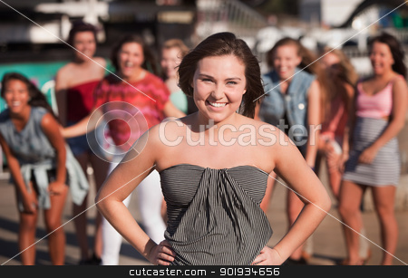 To use this stock image in your creative project, please select the size you need over to the right and click the "Add to Cart" button.
Your downloaded image will come with the Cutcaster watermark removed so don’t worry about the watermark you see on this page. Smiling Young Woman with Friends Outside stock photo, Happy teenage girl at carnival with friends by Scott Griessel