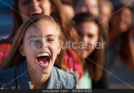 To use this stock image in your creative project, please select the size you need over to the right and click the "Add to Cart" button.
Your downloaded image will come with the Cutcaster watermark removed so don’t worry about the watermark you see on this page. Shouting Girl Outside stock photo, Young happy white teenage girl shouting with friends by Scott Griessel