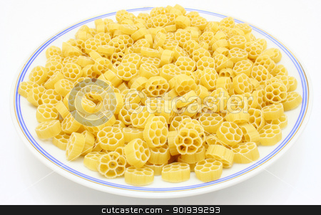 To use this stock image in your creative project, please select the size you need over to the right and click the "Add to Cart" button.
Your downloaded image will come with the Cutcaster watermark removed so don’t worry about the watermark you see on this page. Yellow pasta stock photo, Yellow pasta in the form of wheels on a white background a structure by aarrows