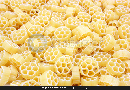 To use this stock image in your creative project, please select the size you need over to the right and click the "Add to Cart" button.
Your downloaded image will come with the Cutcaster watermark removed so don’t worry about the watermark you see on this page. Yellow pasta stock photo, Yellow pasta in the form of wheels on a white background a structure by aarrows