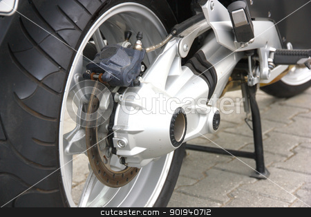 To use this stock image in your creative project, please select the size you need over to the right and click the "Add to Cart" button.
Your downloaded image will come with the Cutcaster watermark removed so don’t worry about the watermark you see on this page. Wheel of motorcycle stock photo, Black wheel of a motorcycle with the chromeplated muffler the rear view by aarrows