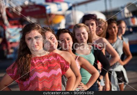 To use this stock image in your creative project, please select the size you need over to the right and click the "Add to Cart" button.
Your downloaded image will come with the Cutcaster watermark removed so don’t worry about the watermark you see on this page. Serious Teenager with Friends stock photo, Serious teenage girl with group of friends outdoors by Scott Griessel