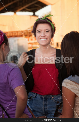 To use this stock image in your creative project, please select the size you need over to the right and click the "Add to Cart" button.
Your downloaded image will come with the Cutcaster watermark removed so don’t worry about the watermark you see on this page. Overjoyed Young Teen with Friends stock photo, Flattered teenage girl talking with friends outdoors by Scott Griessel