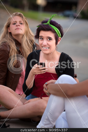 To use this stock image in your creative project, please select the size you need over to the right and click the "Add to Cart" button.
Your downloaded image will come with the Cutcaster watermark removed so don’t worry about the watermark you see on this page. Embarassed Girl with Phone stock photo, Embarrassed teenage girl holding phone outside with friends by Scott Griessel