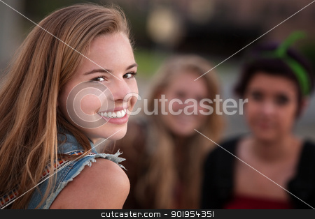 To use this stock image in your creative project, please select the size you need over to the right and click the "Add to Cart" button.
Your downloaded image will come with the Cutcaster watermark removed so don’t worry about the watermark you see on this page. Smiling Teen Girl with Two Friends stock photo, Smiling teenage girl with pair of female friends outdoors by Scott Griessel