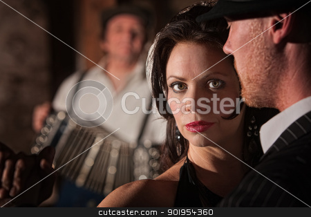 To use this stock image in your creative project, please select the size you need over to the right and click the "Add to Cart" button.
Your downloaded image will come with the Cutcaster watermark removed so don’t worry about the watermark you see on this page. Beautiful Tango Dancer with Partner stock photo, Beautiful tango dancer with partner and accordion musician by Scott Griessel