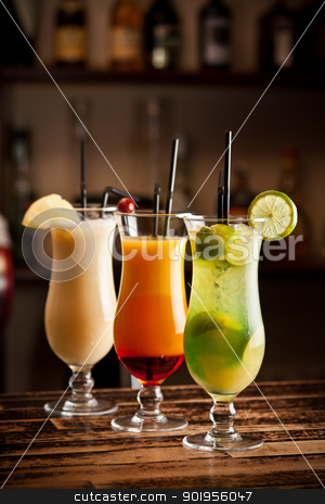To use this stock image in your creative project, please select the size you need over to the right and click the "Add to Cart" button.
Your downloaded image will come with the Cutcaster watermark removed so don’t worry about the watermark you see on this page. Three fresh cocktails stock photo, Three fresh cocktails on a bar table by Grafvision