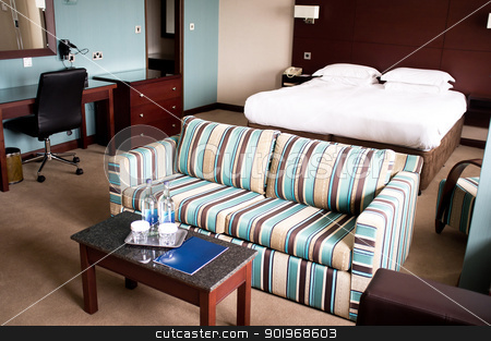 To use this stock image in your creative project, please select the size you need over to the right and click the "Add to Cart" button.
Your downloaded image will come with the Cutcaster watermark removed so don’t worry about the watermark you see on this page. Suite room of a hotel stock photo, Suite room of a hotel with a sofa neatly placed in the middle and mini table placed by Ishay Botbol