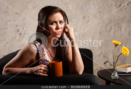 To use this stock image in your creative project, please select the size you need over to the right and click the "Add to Cart" button.
Your downloaded image will come with the Cutcaster watermark removed so don’t worry about the watermark you see on this page. Worried Woman with Cup stock photo, Worried woman holding coffee mug and puckering her lips by Scott Griessel