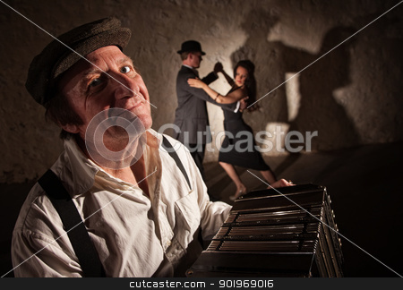 To use this stock image in your creative project, please select the size you need over to the right and click the "Add to Cart" button.
Your downloaded image will come with the Cutcaster watermark removed so don’t worry about the watermark you see on this page. Smiling Accordion Player with Dancers stock photo, Smiling accordion player performing with dancers in the background by Scott Griessel