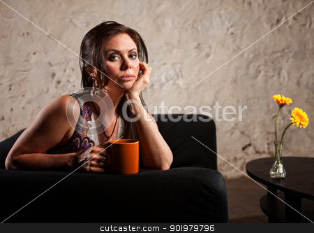 To use this stock image in your creative project, please select the size you need over to the right and click the "Add to Cart" button.
Your downloaded image will come with the Cutcaster watermark removed so don’t worry about the watermark you see on this page. Serious Lady on Sofa stock photo, Serious young woman holding coffee mug sitting near table by Scott Griessel