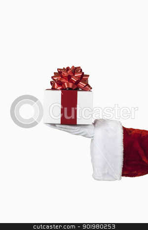 To use this stock image in your creative project, please select the size you need over to the right and click the "Add to Cart" button.
Your downloaded image will come with the Cutcaster watermark removed so don’t worry about the watermark you see on this page. Santa Holding a Gift stock photo, Santa holding a christmas present, includes clipping path by Bryan Mullennix