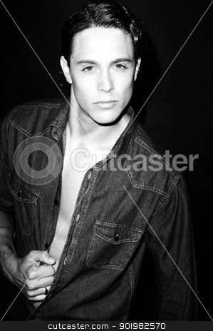 To use this stock image in your creative project, please select the size you need over to the right and click the "Add to Cart" button.
Your downloaded image will come with the Cutcaster watermark removed so don’t worry about the watermark you see on this page. Sexy fine art black and white portrait of a very handsome male model stock photo, Sexy fine art black and white portrait of a very handsome male model posing in denims by Ishay Botbol