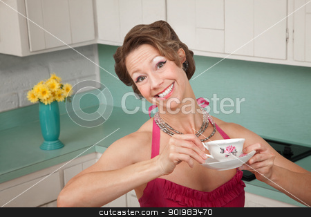 To use this stock image in your creative project, please select the size you need over to the right and click the "Add to Cart" button.
Your downloaded image will come with the Cutcaster watermark removed so don’t worry about the watermark you see on this page. Loving Coffee stock photo, Woman with a big smile enjoys a cup of coffee in her kitchen by Scott Griessel