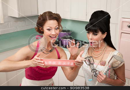 To use this stock image in your creative project, please select the size you need over to the right and click the "Add to Cart" button.
Your downloaded image will come with the Cutcaster watermark removed so don’t worry about the watermark you see on this page. Excited Women stock photo, Two excited Caucasian women trying out a new recipe by Scott Griessel