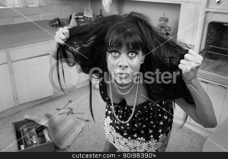 To use this stock image in your creative project, please select the size you need over to the right and click the "Add to Cart" button.
Your downloaded image will come with the Cutcaster watermark removed so don’t worry about the watermark you see on this page. Woman Pulls Her Hair stock photo, Desperate housewife in a kitchen pulls her hair by Scott Griessel
