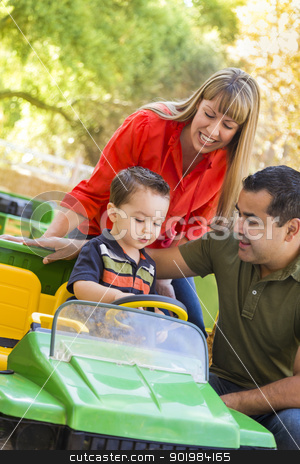 To use this stock image in your creative project, please select the size you need over to the right and click the "Add to Cart" button.
Your downloaded image will come with the Cutcaster watermark removed so don’t worry about the watermark you see on this page. Young Mixed Race Boy Enjoys Toy Tractor with Parents stock photo, Happy Young Mixed Race Boy Enjoys A Toy Tractor While Parents Look On. by Andy Dean