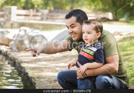 To use this stock image in your creative project, please select the size you need over to the right and click the "Add to Cart" button.
Your downloaded image will come with the Cutcaster watermark removed so don’t worry about the watermark you see on this page. Hispanic Father Points with Mixed Race Son at the Park stock photo, Happy Hispanic Father Points with Mixed Race Son at the Park Pond. by Andy Dean