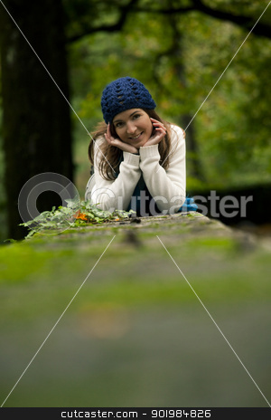 To use this stock image in your creative project, please select the size you need over to the right and click the "Add to Cart" button.
Your downloaded image will come with the Cutcaster watermark removed so don’t worry about the watermark you see on this page. Beautiful young woman in nature stock photo, Outdoor portrait of a beautiful young woman lying on a stonewall by ikostudio