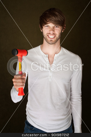 To use this stock image in your creative project, please select the size you need over to the right and click the "Add to Cart" button.
Your downloaded image will come with the Cutcaster watermark removed so don’t worry about the watermark you see on this page. Man Holds Mallet stock photo, Smiling young Caucasian male with red mallet by Scott Griessel