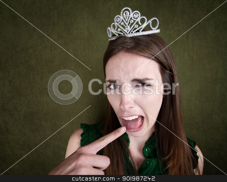 To use this stock image in your creative project, please select the size you need over to the right and click the "Add to Cart" button.
Your downloaded image will come with the Cutcaster watermark removed so don’t worry about the watermark you see on this page. Young Queen Makes a Gagging Gesture stock photo, Disgusted Young Woman with a crown tiara and gagging gesture by Scott Griessel