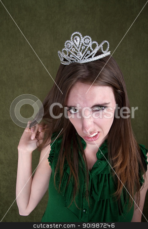 To use this stock image in your creative project, please select the size you need over to the right and click the "Add to Cart" button.
Your downloaded image will come with the Cutcaster watermark removed so don’t worry about the watermark you see on this page. Disgusted Young Woman stock photo, Caucasian woman with tiara plays with her hair by Scott Griessel