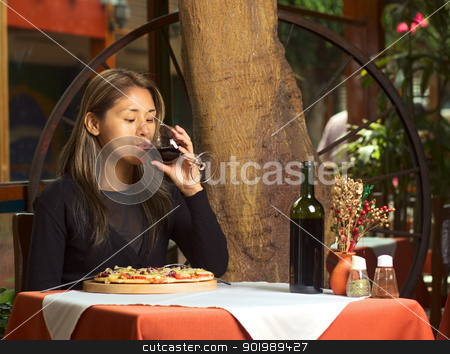 To use this stock image in your creative project, please select the size you need over to the right and click the "Add to Cart" button.
Your downloaded image will come with the Cutcaster watermark removed so don’t worry about the watermark you see on this page. Latina Drinking Wine in Restaurant stock photo, Beautiful young Peruvian woman enjoying her wine and eating pizza in a restaurant by Ildi Papp