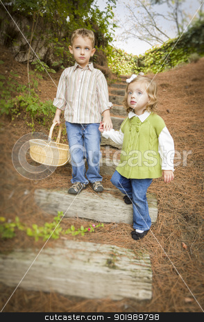 To use this stock image in your creative project, please select the size you need over to the right and click the "Add to Cart" button.
Your downloaded image will come with the Cutcaster watermark removed so don’t worry about the watermark you see on this page. Two Children Walking Down Wood Steps with Basket Outside. stock photo, Adorable Brother and Sister Children Holding Hands Walking Down Wood Steps with Basket Outside. by Andy Dean