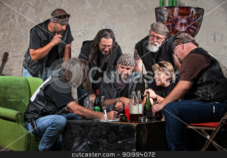 To use this stock image in your creative project, please select the size you need over to the right and click the "Add to Cart" button.
Your downloaded image will come with the Cutcaster watermark removed so don’t worry about the watermark you see on this page. Gang Making Plans stock photo, Seven biker gang members writing a plan indoors by Scott Griessel