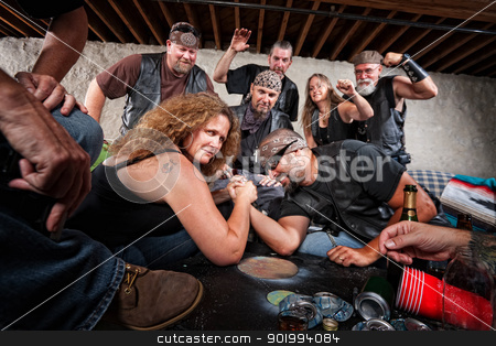 To use this stock image in your creative project, please select the size you need over to the right and click the "Add to Cart" button.
Your downloaded image will come with the Cutcaster watermark removed so don’t worry about the watermark you see on this page. Grinning Woman Wins Arm Wrestling Match stock photo, Tough grinning woman defeats biker in arm wrestling contest by Scott Griessel