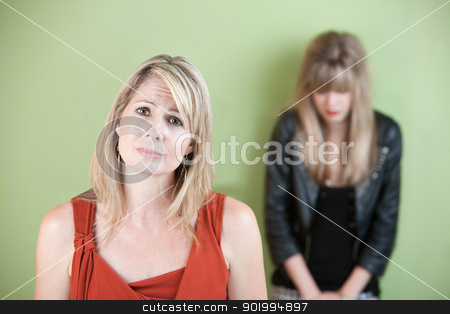 To use this stock image in your creative project, please select the size you need over to the right and click the "Add to Cart" button.
Your downloaded image will come with the Cutcaster watermark removed so don’t worry about the watermark you see on this page. Unhappy Mom stock photo, Unhappy Caucasian mom with sad daughter over green background by Scott Griessel