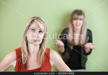 To use this stock image in your creative project, please select the size you need over to the right and click the "Add to Cart" button.
Your downloaded image will come with the Cutcaster watermark removed so don’t worry about the watermark you see on this page. Frustrated Mom stock photo, Disappointed mom with frustrated daughter in background by Scott Griessel
